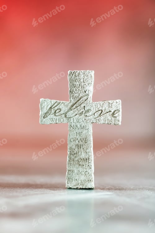 Preview: Stone cross with inscription Believe on red background, Copy space. Christian backdrop. Biblical