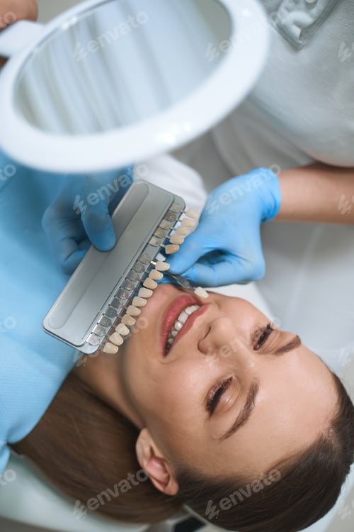 Preview: Happy pretty female seeing dentist stock photo