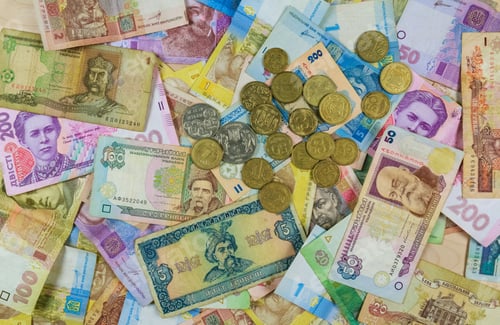 Preview: Different currency bills creating a colorful background Money from different countries