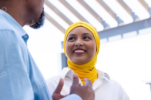 Preview: Happy diverse business people discussing and smiling outside office