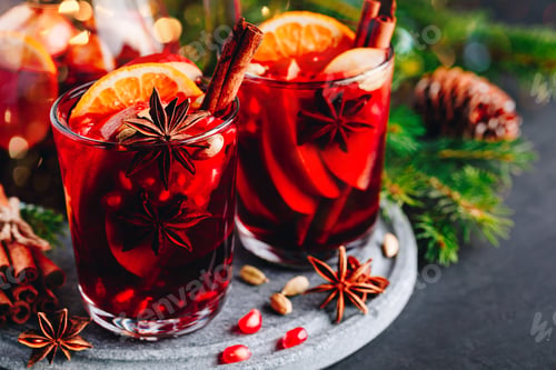 Preview: Christmas sangria or mulled wine with apples, oranges, pomegranate and cinnamon sticks.