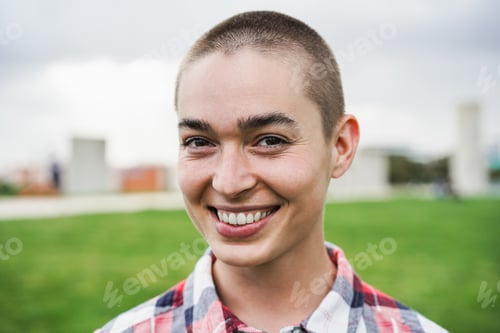 Preview: Bald girl smiling on camera at city park - Focus on face - Main focus on right eye