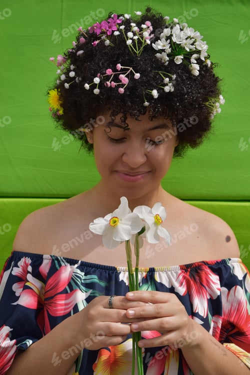 Preview: Young Woman with Floral Hairstyle Holding White Flowers