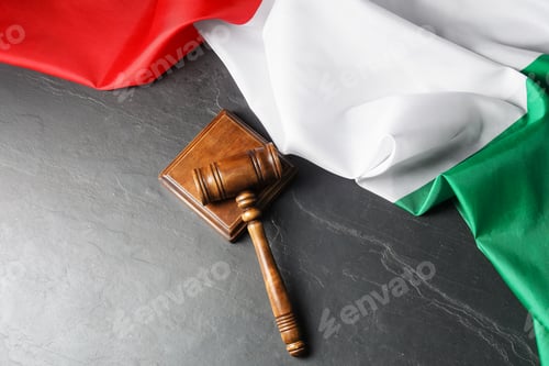 Preview: Judge's gavel and flag of Italy on black table, top view