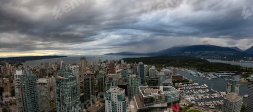 Preview: Aerial view of Downtown City during a stormy summer evening before sunset