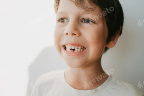 Preview: Portrait of a 6-year-old with a fallen milk tooth