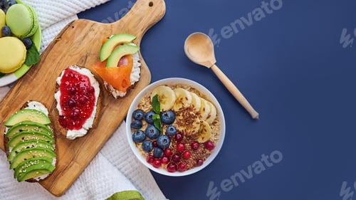 Vista previa: breakfast top view black background. oatmeal with berries, toasts on a wooden tray, nuts, coffee