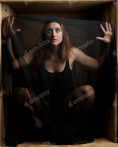 Preview: Sensual model under veil sitting in box