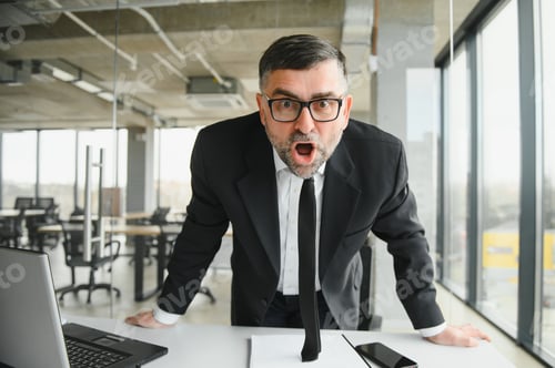 Preview: Angry businessman with document shouting at somebody