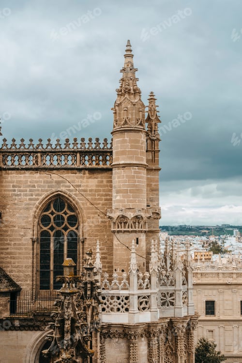 Preview: one of towers of cathedral of Seville on cloudy day