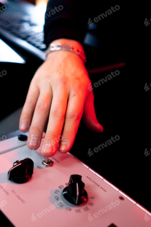 Preview: in the recording room under neon lighting professional remote control for adjusting the sound the