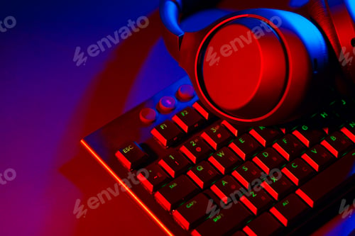 Preview: Headphones on a computer keyboard on black background