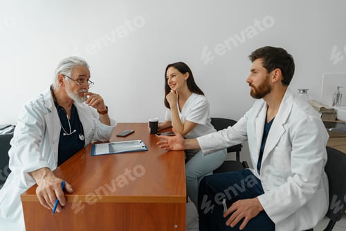 Preview: Successful medical doctors are discussing diagnosis during the conference