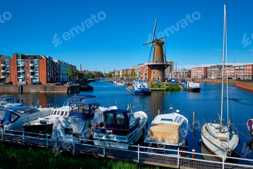 Preview: View of the harbour of Delfshaven and the old grain mill De Destilleerketel. Rotterdam, Netherlands