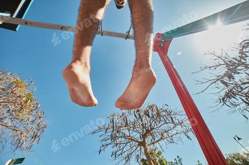 Preview: Man on swings from below