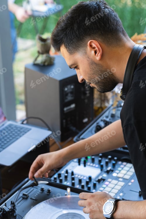 Preview: Sound engineer preparing the mixing console before starting the concert