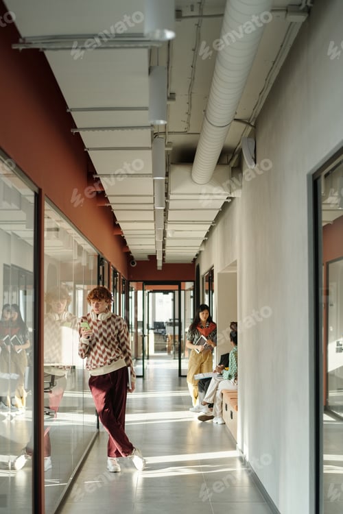 Preview: Walking through Creative Coworking Space Young Caucasian Man Holding Coffee