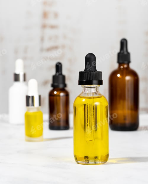 Preview: A set of organic cosmetics in glass vials with dropper for skin and hair care. Bottles with essentia