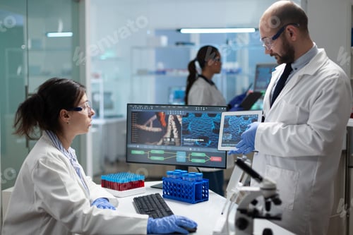 Preview: Medical team of biologist researcher working at coronavirus treatment