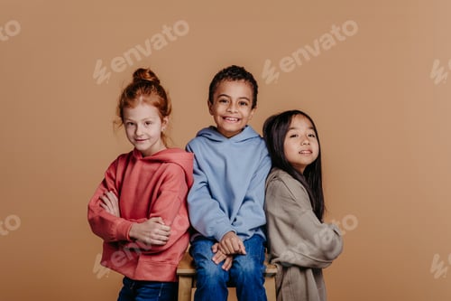 Preview: Portrait of three children, studio shoot. Concept of diversity in friendship.