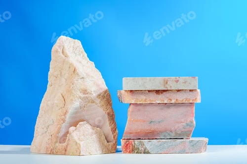 Preview: Pieces of granite stone against blue background