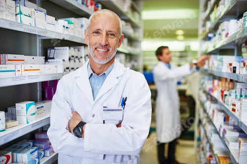 Preview: Here for your health. Portrait of a confident mature pharmacist working in a pharmacy.