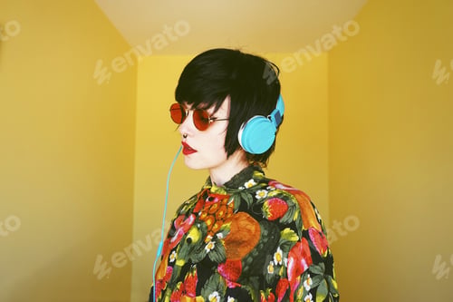 Preview: Cool androgynous dj woman in vibrant colors