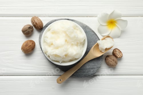 Preview: Natural shea butter on white wooden table, flat lay