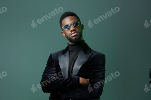 Preview: Elegant duo confident men in formal attire, one in a black suit and sunglasses, the other in a