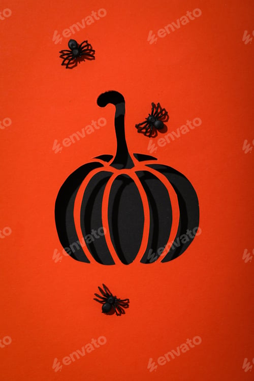 Preview: Paper pumpkin and decorative spiders on red background, top view