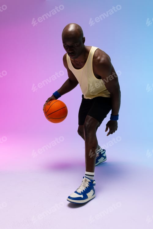 Preview: Image of african american basketball player with basketball on neon purple to blue background