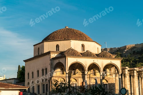 Preview: Historic domed architecture under a clear blue sky at golden hour