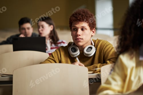 Preview: Young Multiethnic University Students Attending Lecture and Taking Notes