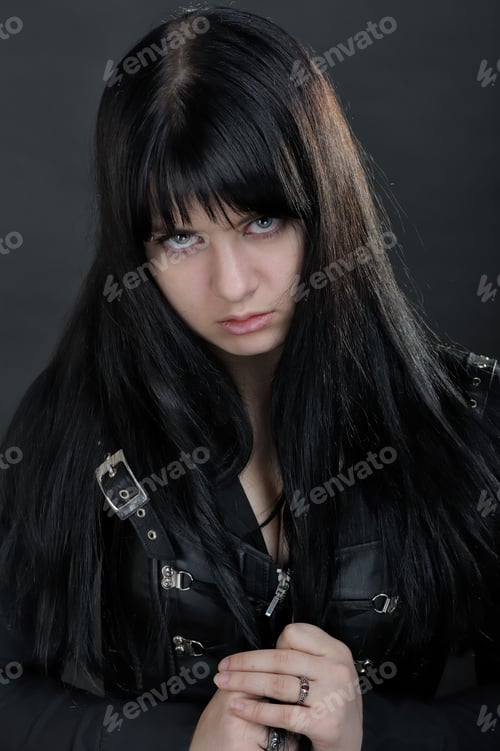 Preview: Portrait Of Brunette Girl On Dark Background