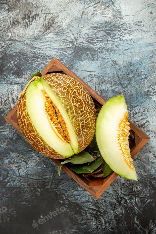Preview: top view sliced fresh melon on dark-light background sweet fruit mellow summer