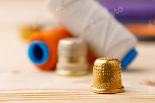Preview: Threads and sewing accessories on wooden table