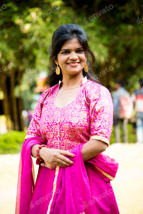 Preview: Outdoor portrait of beautiful young Indian girl in traditional dress.