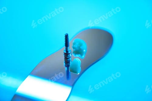 Preview: There is pin and models of human teeth on mirror