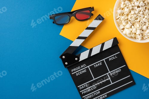 Preview: A flat lay of movie night essentials including a clapperboard, 3D glasses