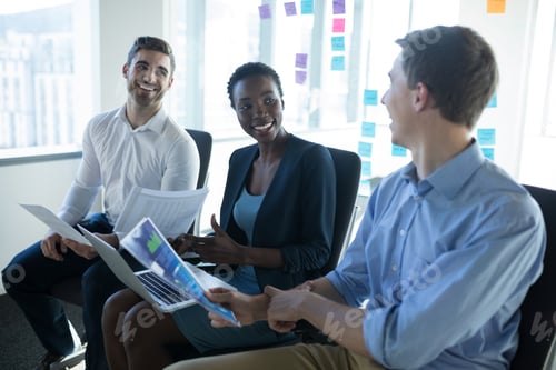 Preview: Attentive executives discussing over graph