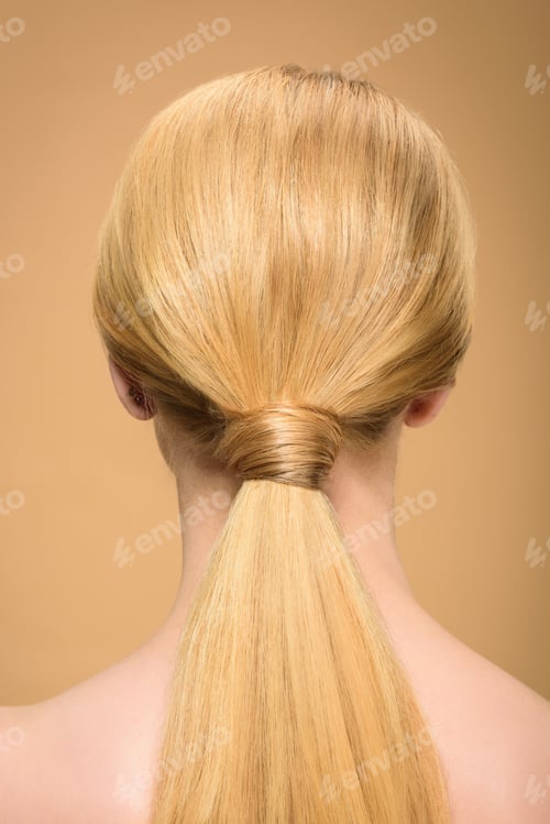 Preview: rear view of young blonde woman with long straight smooth hair isolated on beige