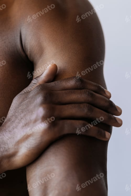 Preview: Man touching his arm