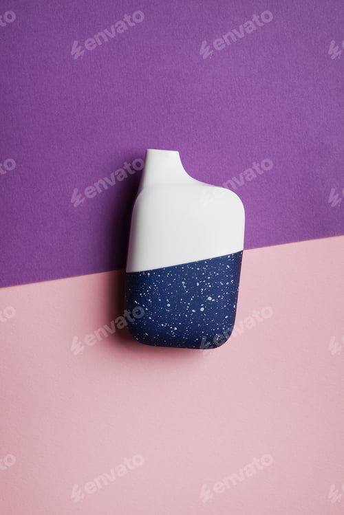 Preview: disposable electronic cigarette or vape on purple background. top view copy space.