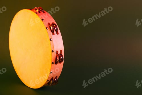 Preview: Tambourine on olive background. Space for text