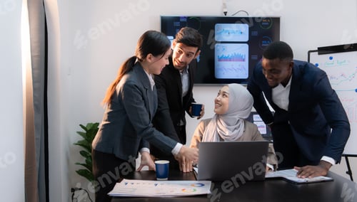 Preview: Multiethnic group of business people working together in a modern office