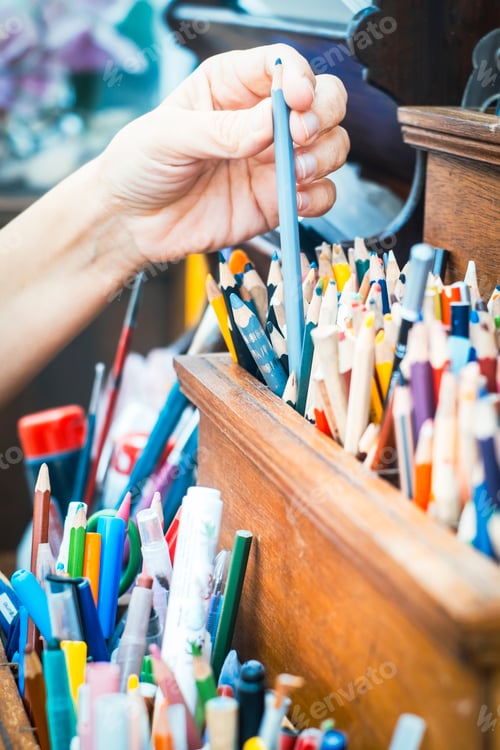 Preview: Close up of woman hands taking pencils to enjoy hobby or work. Alternative indoor leisure