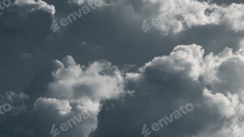 Preview: Dramatic rainclouds lit with bright sun, clouds in gray sky