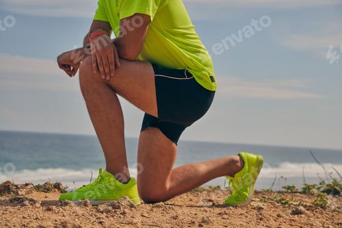 Preview: Sportsman Stretching On A Tropical Exotic Cliff Near The Ocean.