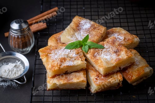 Preview: Greek pie called Bougatsa with cheese slightly blurred cross section and selective focus