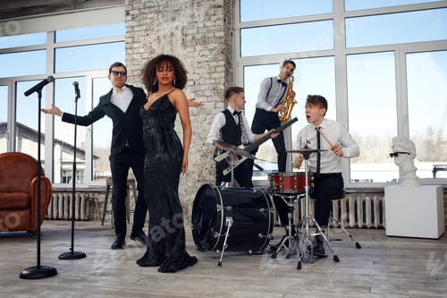 Preview: Repetition of multi ethnic jazz band in loft. Bass guitar player, electric guitar player